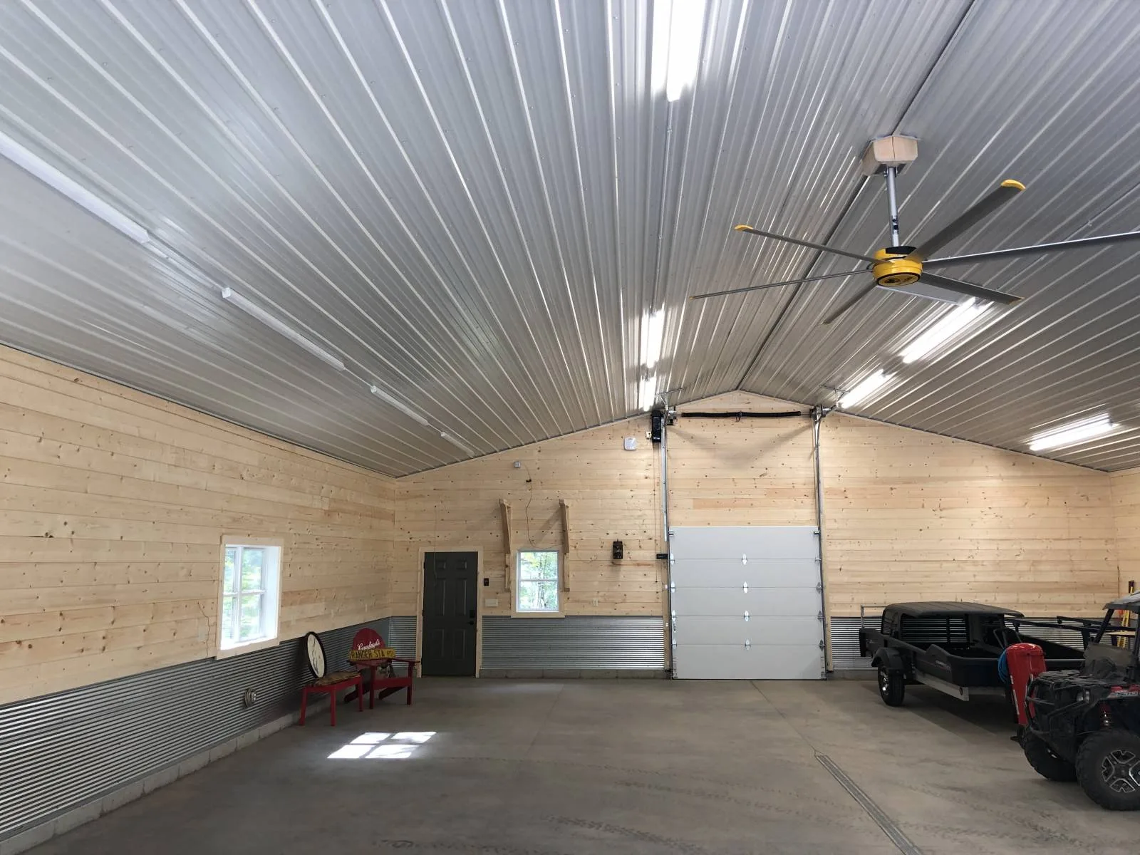 Shop interior with metal ceiling and wood-lined walls, from Keenan's gallery