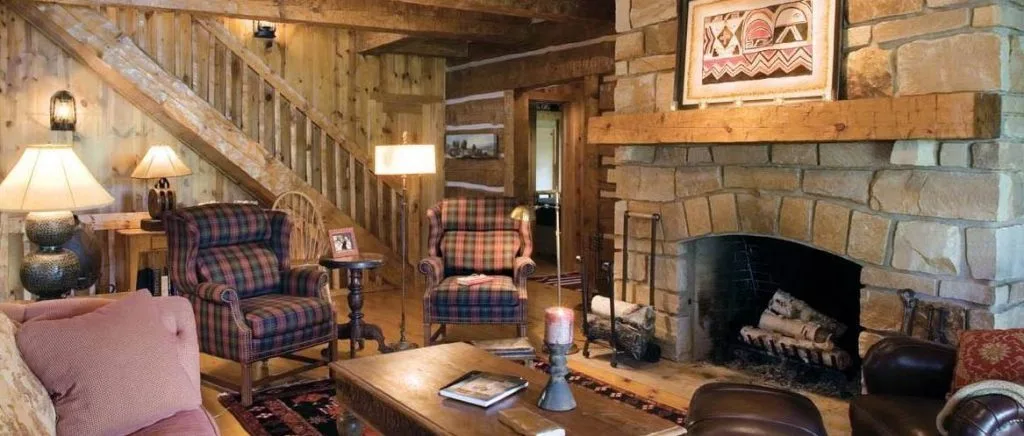 Stone fireplace and wood interior pictured on Keenan's remodels page